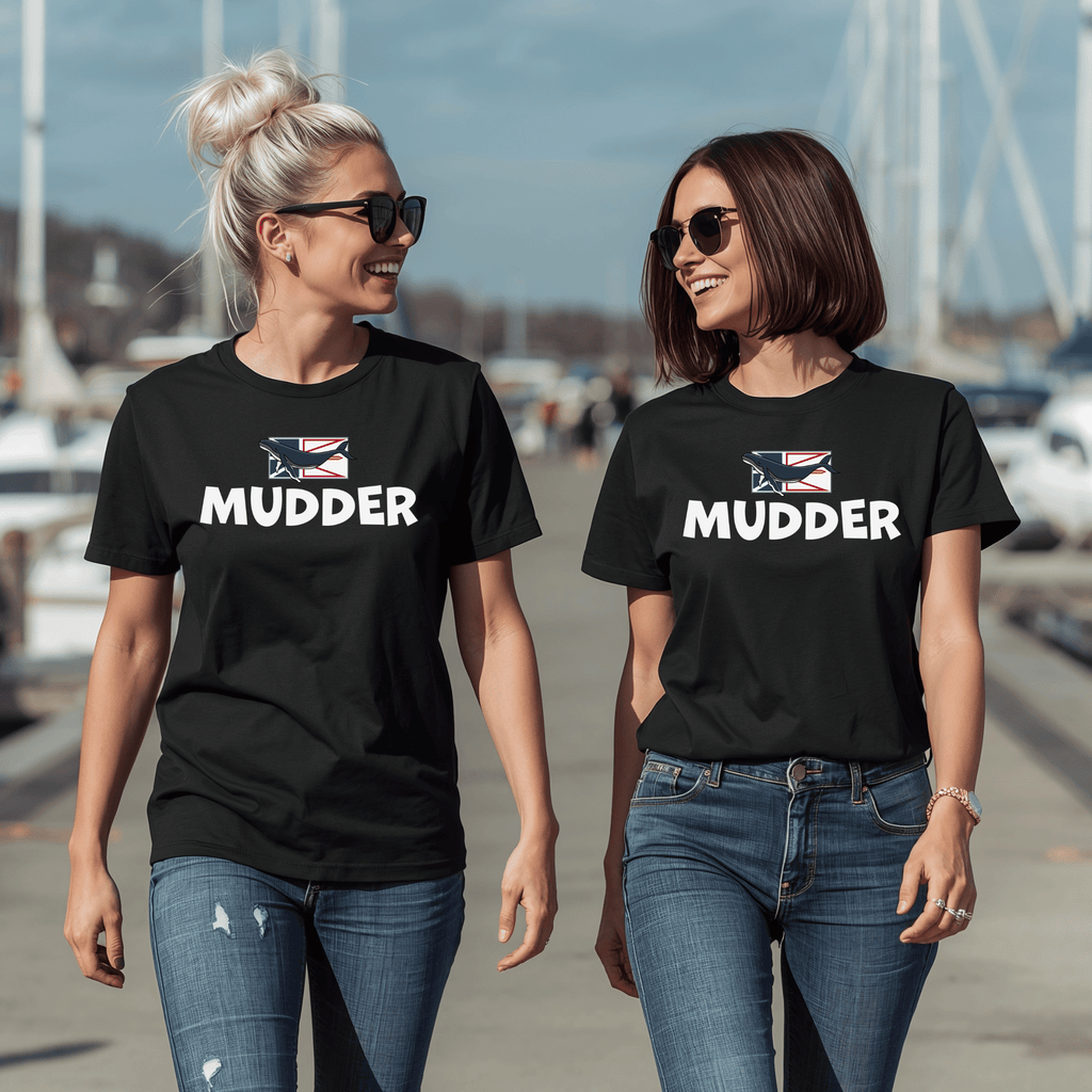 Two women wearing black t-shirts with 'Mudder' text and a whale on flag design, walking outdoors.