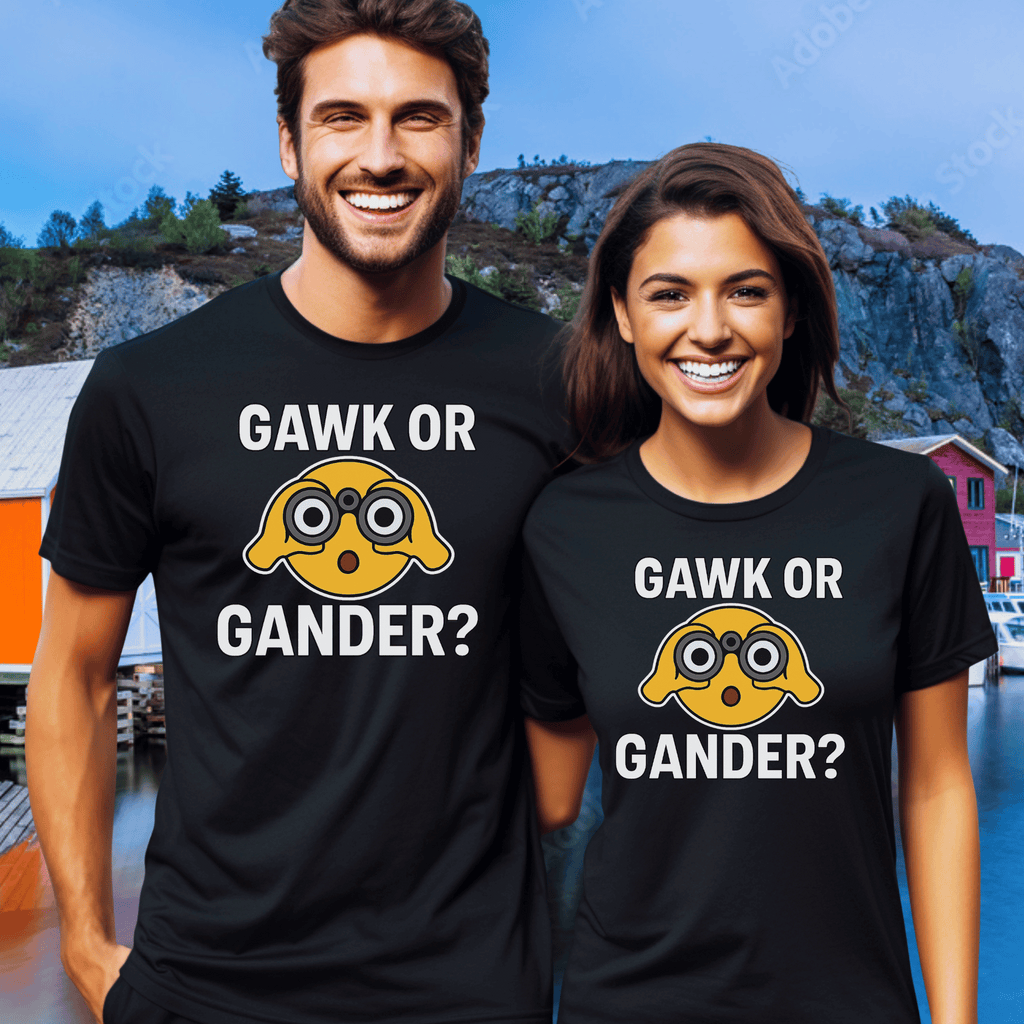 Two people wearing black t-shirts with a graphic of an emoji with binoculars and text saying "Gawk or Gander" in an outdoor setting.