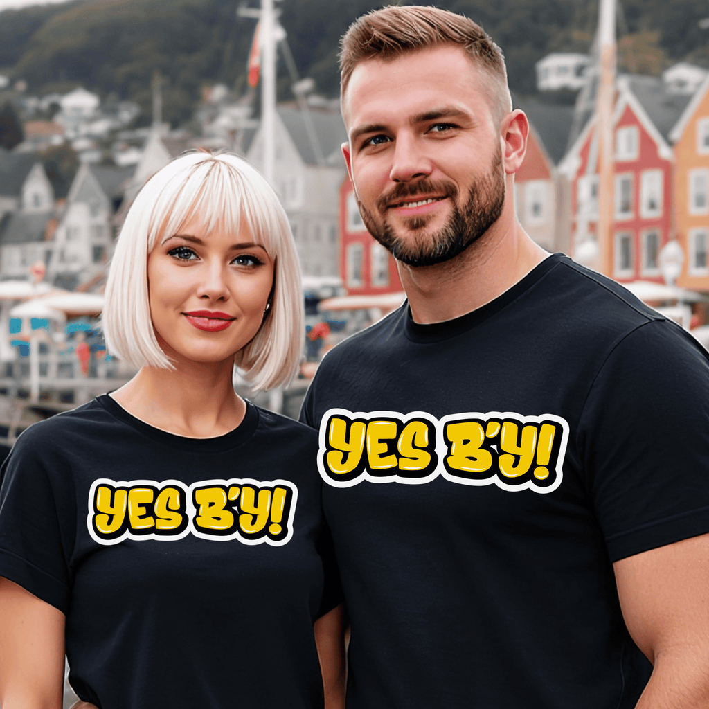 Two people wearing black t-shirts with 'YES B'Y!' text in a harbor setting.