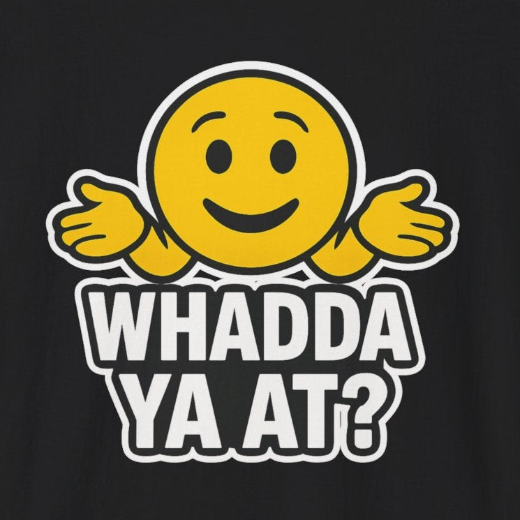Black t-shirt with an emoji holding his hands out as if asking a question and the words "Whadda Ya At?"
