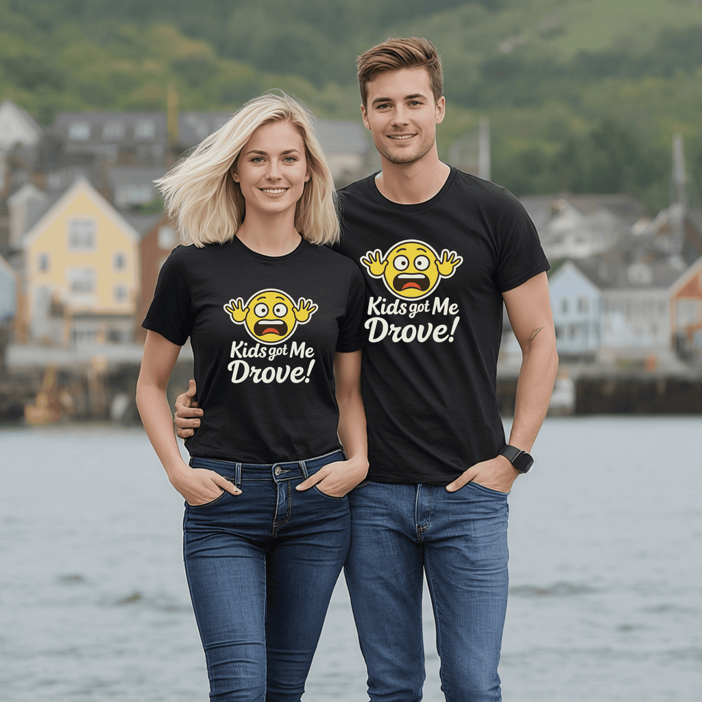 Two lovely couple wearing black t-shirts with hysterical emoji designs and text  saying "Kids Got Me Drove." standing by a waterfront.