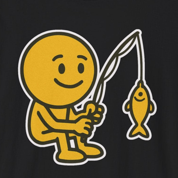 Black t-shirt with a yellow graphic of a smiley face emoji fishing on a black background