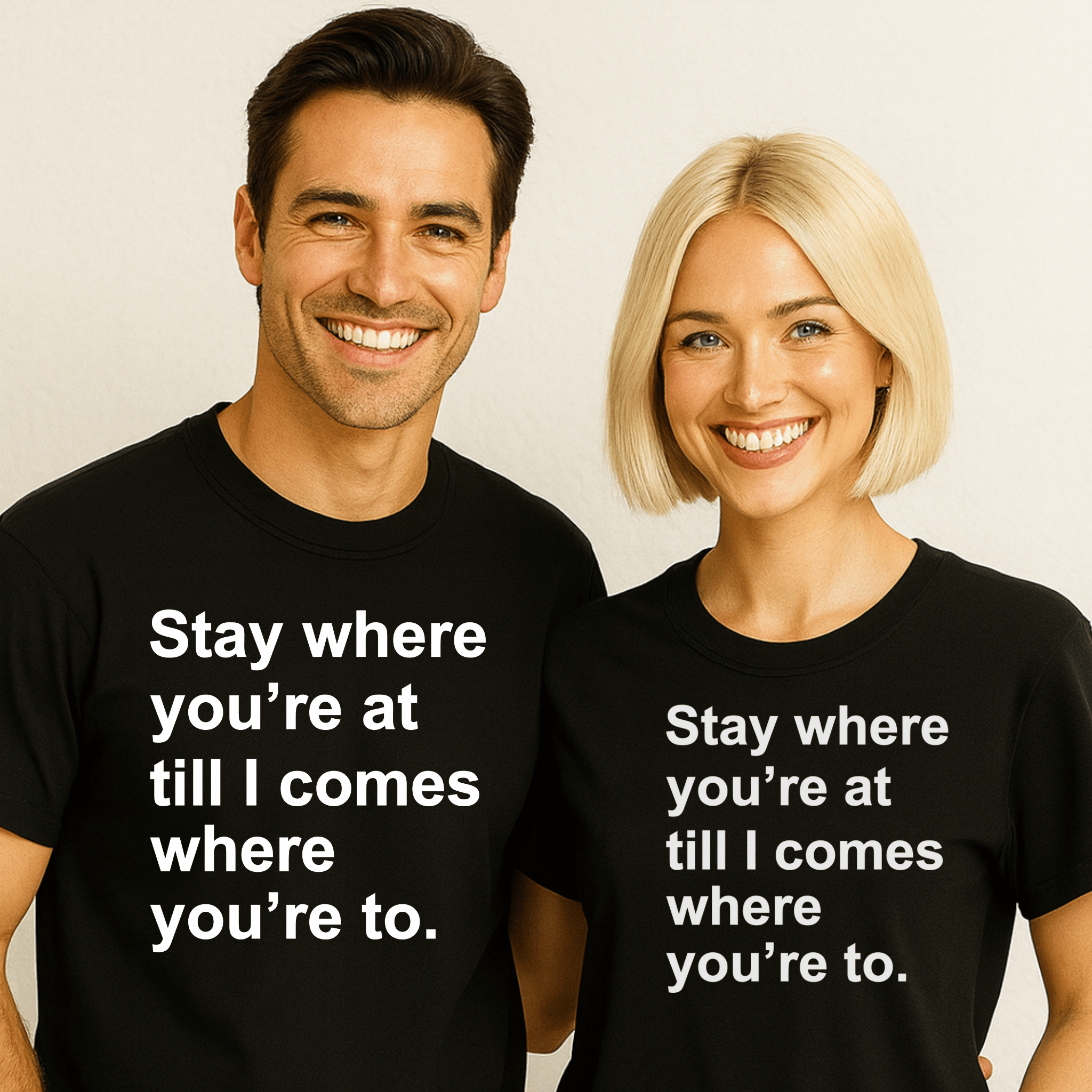 An attractive couple wearing matching t-shirts saying "stay where you're at till I comes where you're to."