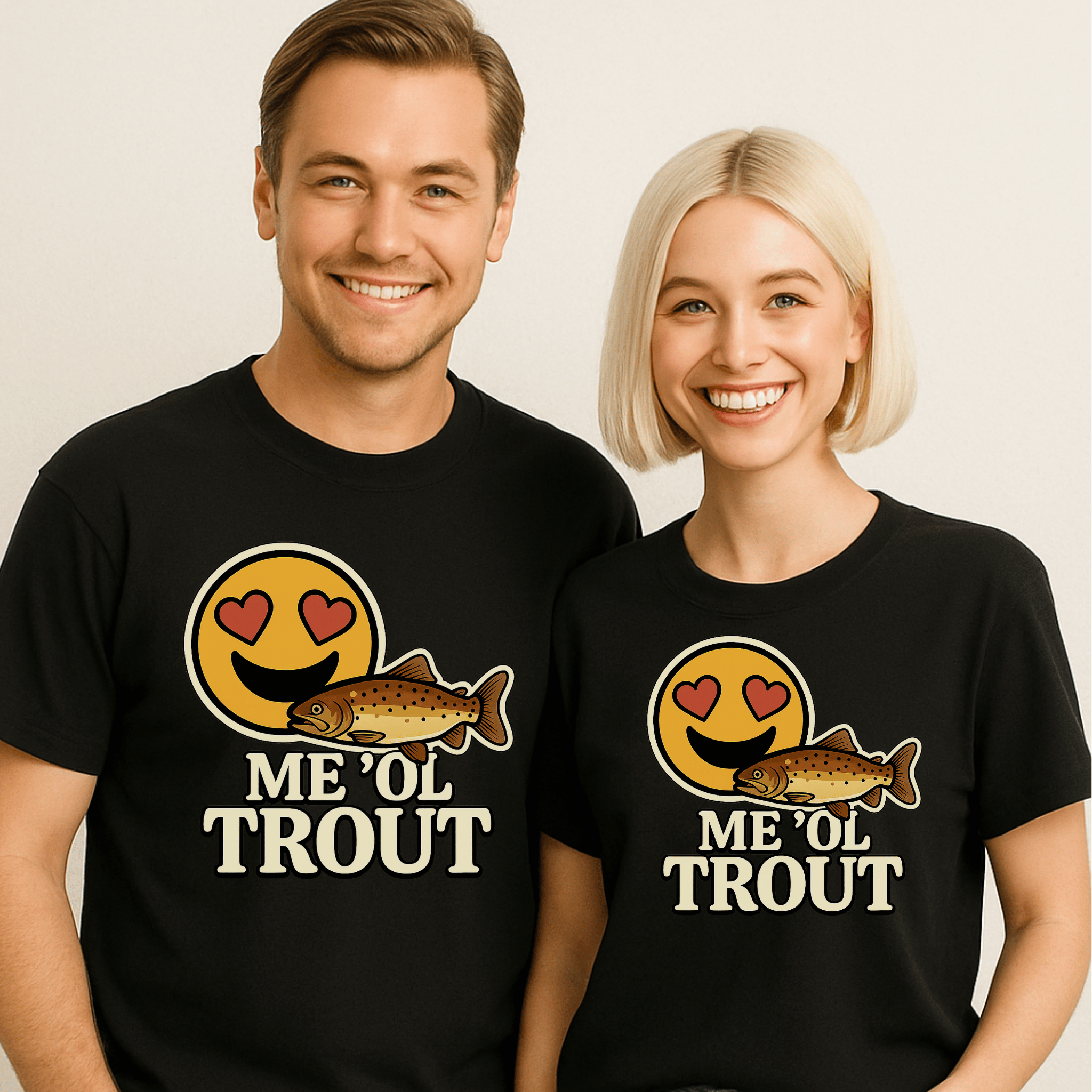 A good-looking couple wearing mathinc black t-shirts with an emoji with heart eyes and a trout, and the text "Me 'Ol Trout."