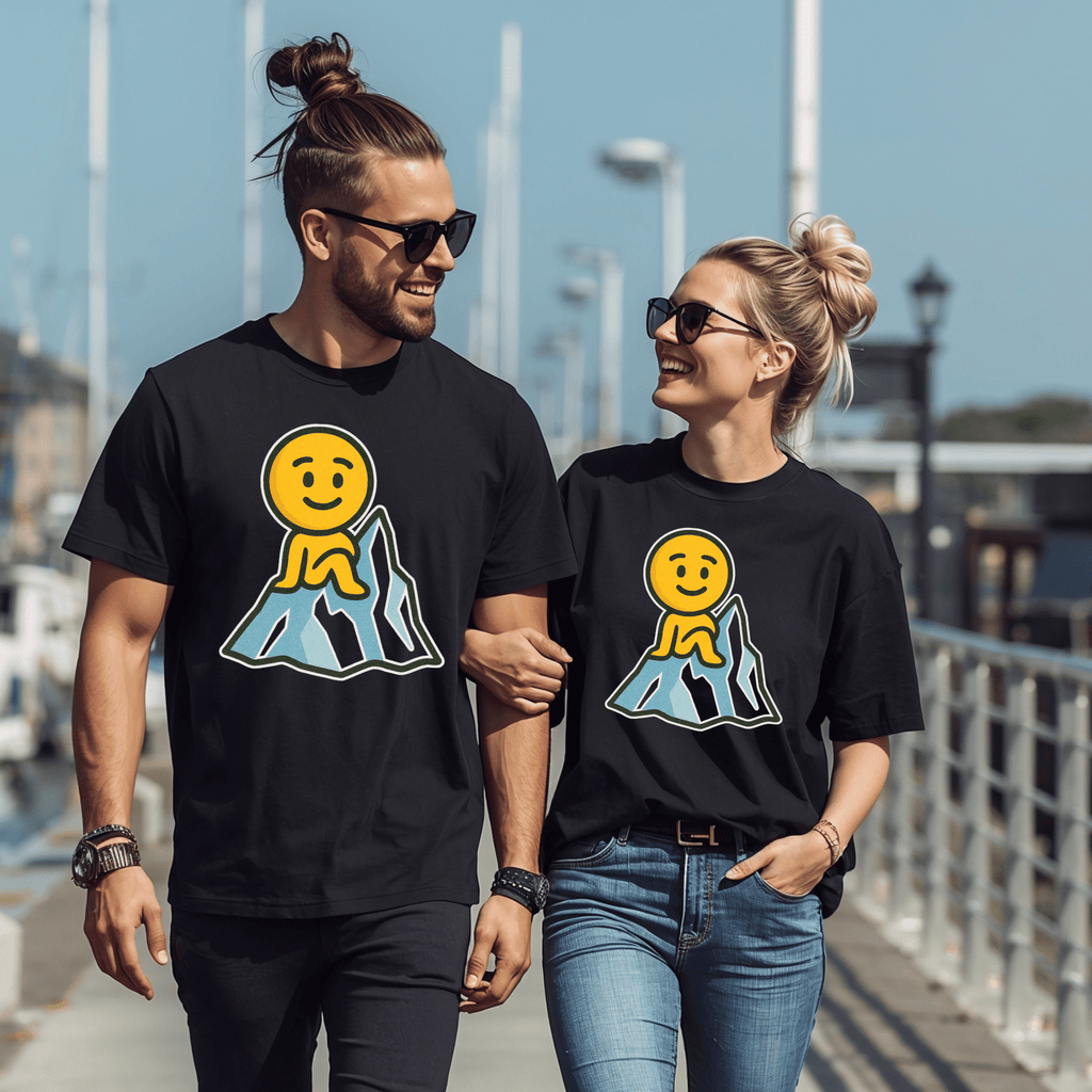 Two attractive people wearing black t-shirts with a smiley face emoji sitting on an iceberg, and walking together outdoors.