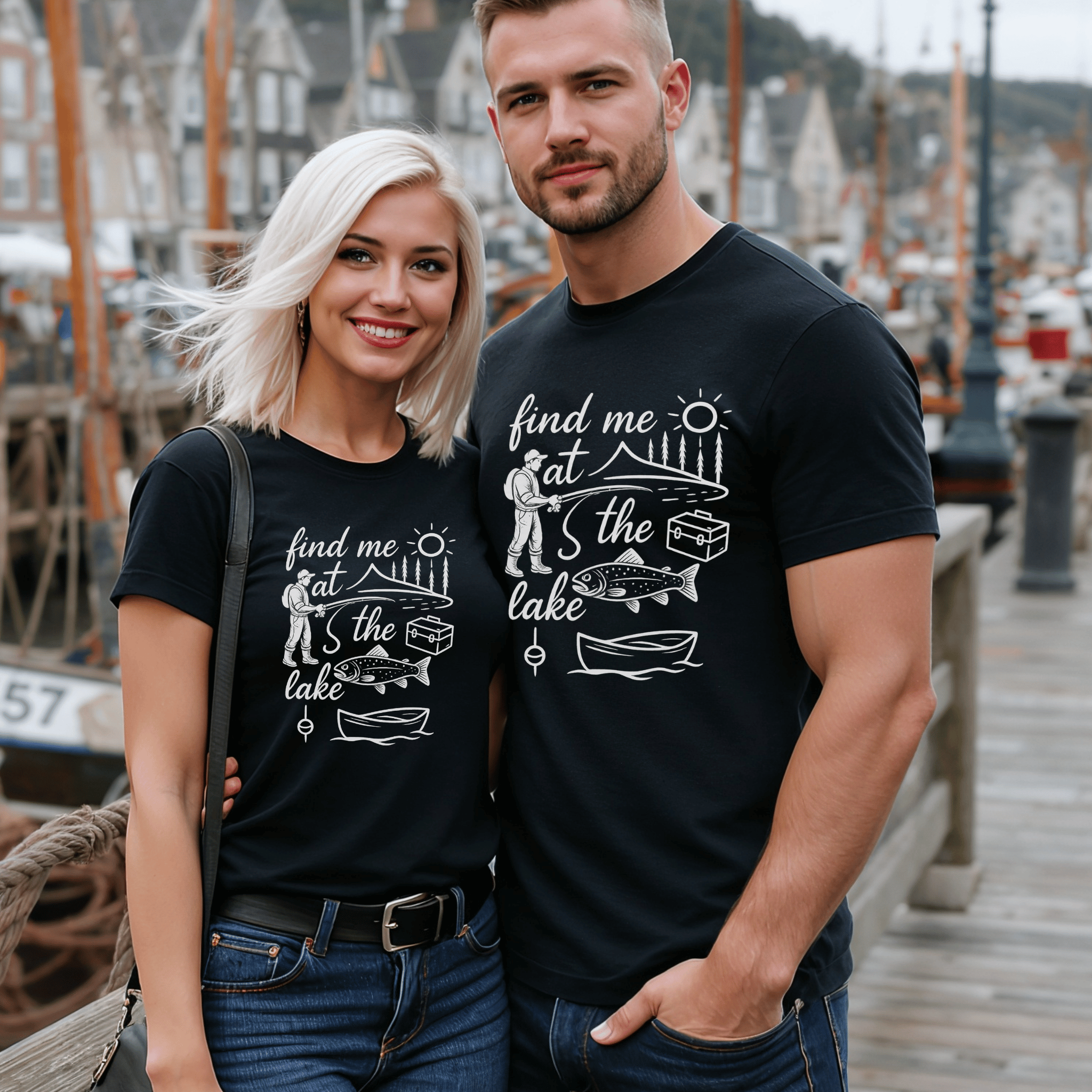 Attractive man and woman wearing matching black t-shirts with lake-themed design saying "find me at the lake."
