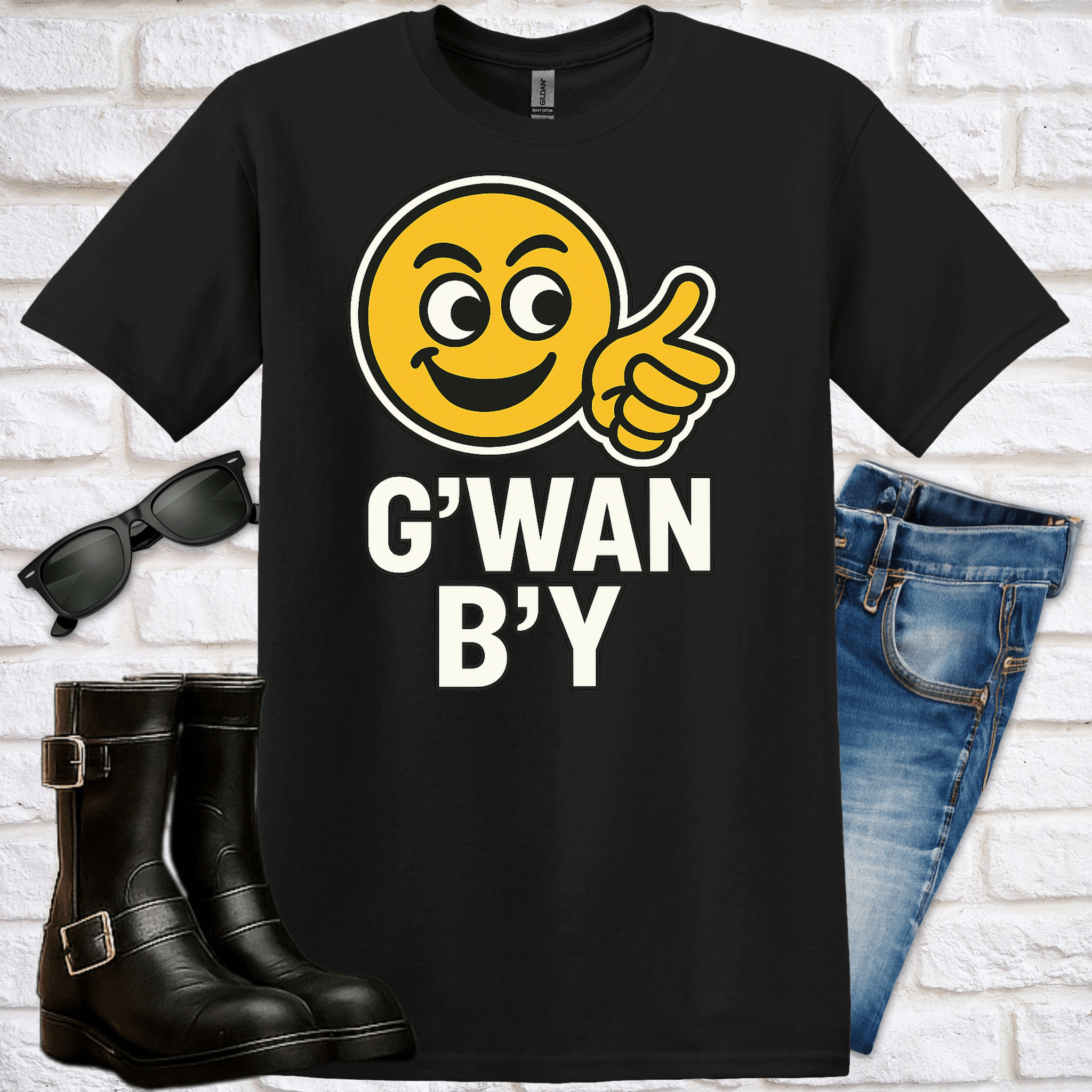 Black t-shirt with a smiley face and text saying "G;wan B;y" sunglasses, boots, and jeans on a white brick background