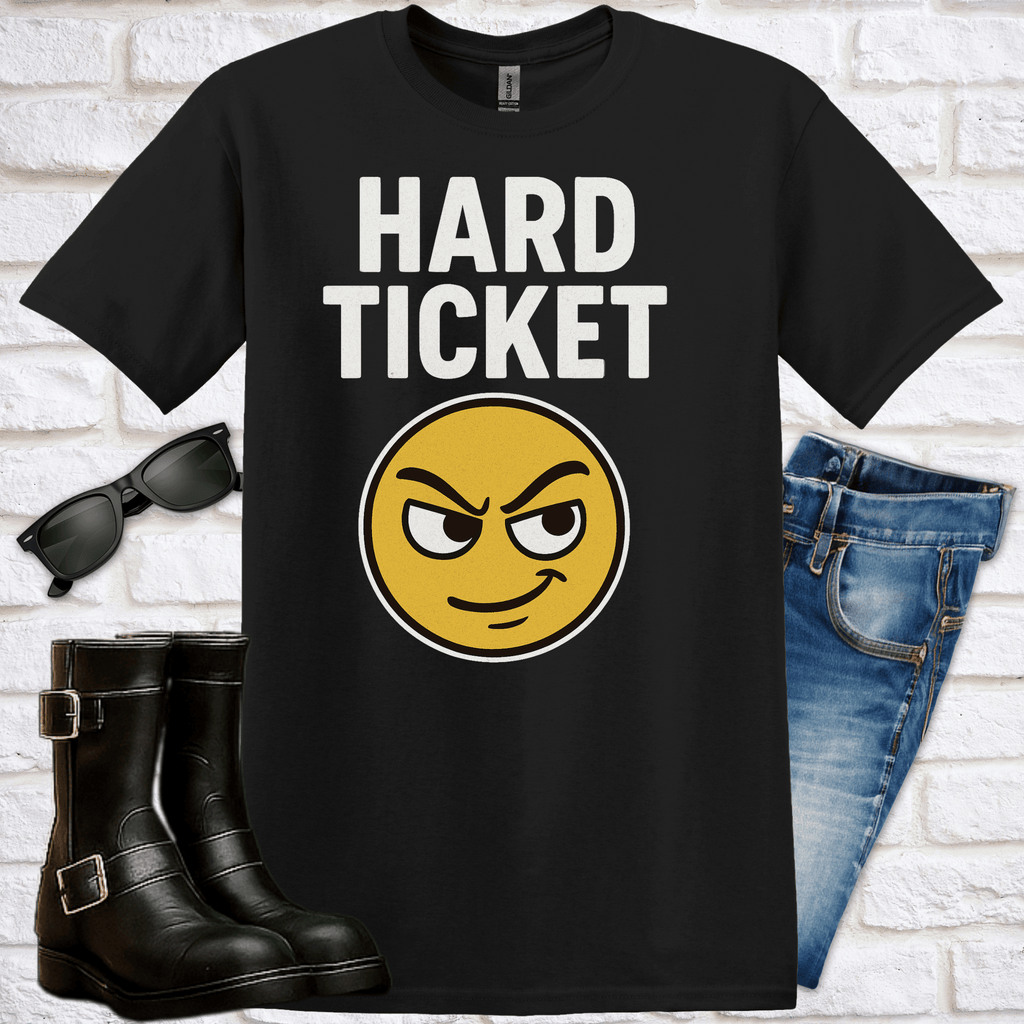 Black t-shirt with 'Hard Ticket' and a rascal emoji, sunglasses, and jeans on a white brick background