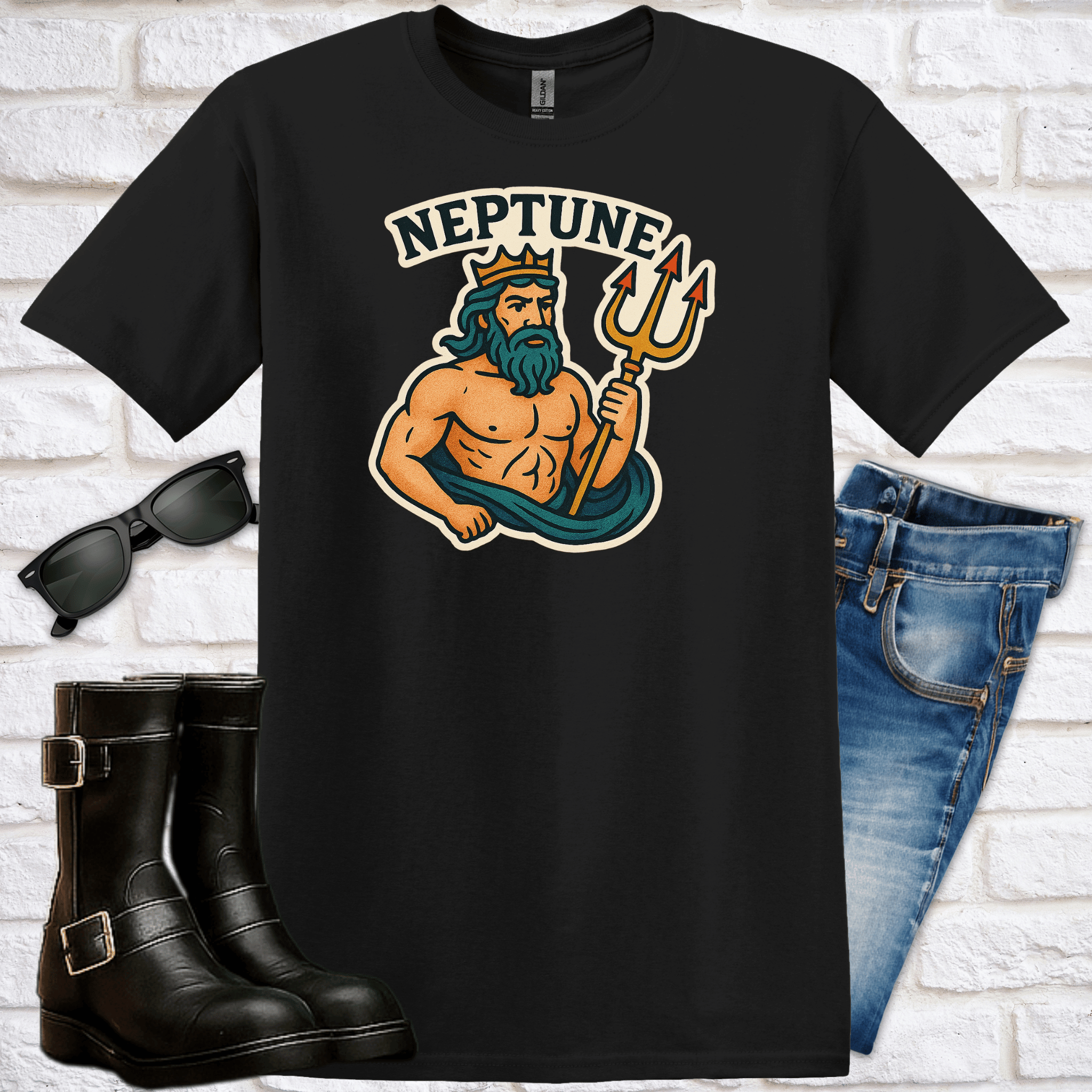 Black t-shirt with Neptune graphic design and the text "Neptune" on a white brick wall background with jeans, boots and sunglasses.
