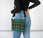 Person wearing the Newfoundland and Labrador Tartan Crossbody Purse over their shoulder against a white background